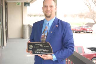 ER Shannon McCord holding award from Nebraska Elks Assn. Best Lodge Website 2008-2009, awarded to Superior Lodge.