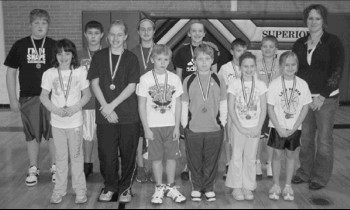 First and second place medalists in the Elks' annual Hoop Shoot® proudly
display their awards. They are (back row from left), Caleb Isom, Trevor Allen,
Keidra Mathews, Abbey Anderson, Jarrett Arasmith, Trey Kuhlman and
Sarah Kirchhoff, event chairperson, (front) Riliegh Gardener, Kali Valek,
Lane Deisley, Heath White, Lynnae Benyshek and Molly McCartney.