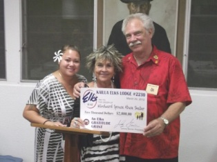 John Nagy presents Gratitude Grant to Avis Kalama of Windward Spouse Abuse Center