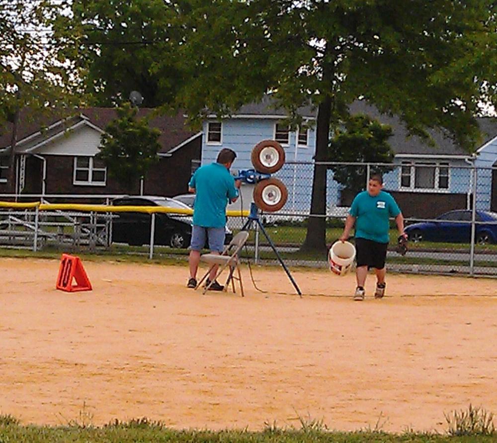 Member Mike and Antler Josh setting up baseball batter up