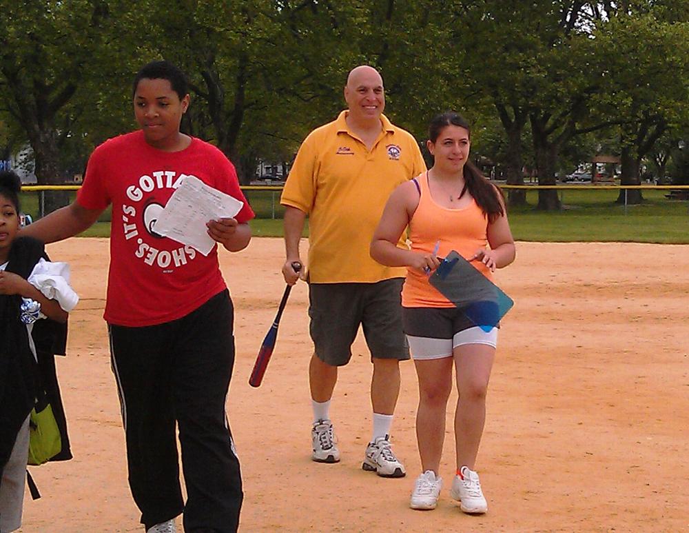 Member Sal with Antler President Cryssi working softball batter up