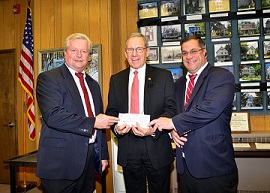 Bill Kanze, PDD & Jim Riccuitti, PDD donating $2,200.00 to the Closter Food Bank.  Receiving check is John Glidden, Mayor of Closter.
