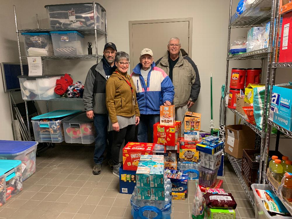 PER Jay Mason, Veterans Affairs Chairman Bob Maraio, and Treasurer Bob McIntyre deliver items for the Military Comfort Room at the Syracuse airport. These supplies, hopefully, make active military members more comfortable as they travel. (2018) 