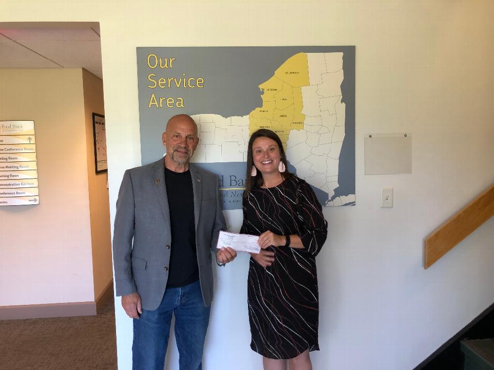 Exalted Ruler Jay Mason presents Heidi Soine, the Development Coordinator at the Food Bank of Central New York with a $350 check to help provide food for individuals in need. There motto is "Do Right and Feed Everyone" and the Camillus Lodge is helping the agency do that. Camillus Elks Lodge giving back to the community. 