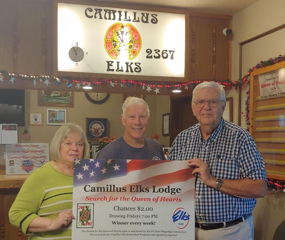 Secretary Cheryl Chesneski and Treasurer Bob McIntyre (right) are joined by the winner of a recent Queen of Hearts jackpot. (2019)