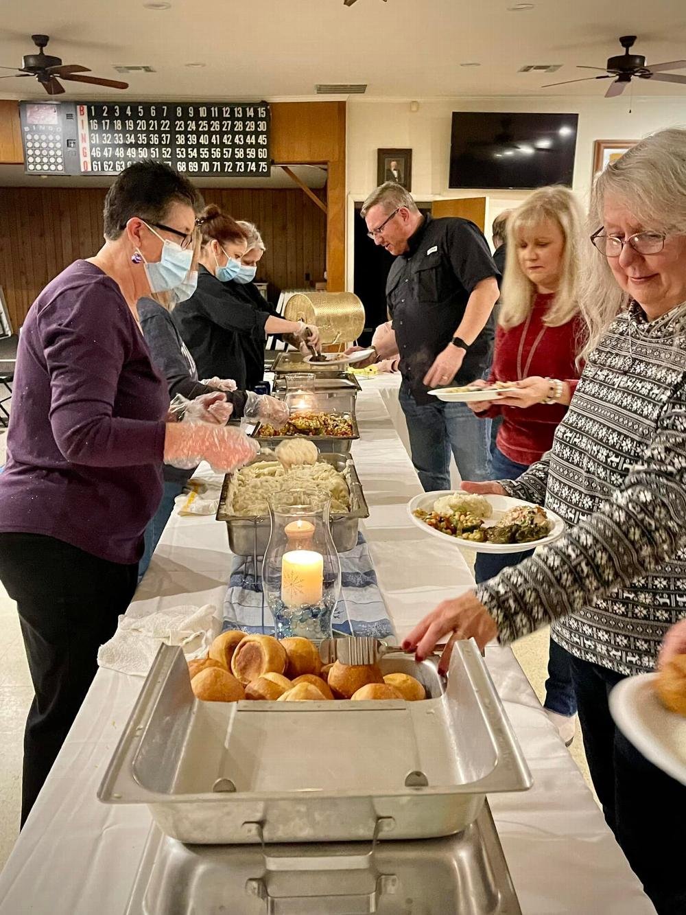 Exalted Ruler John Stammreich and First Lady Andrea Stammreich prepare their food plates at the Denton Lady Elks Member Appreciation Dinner