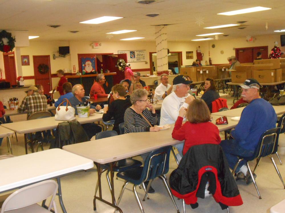 Some of the Elks/elves after Friday night packing is complete.  Refrigerated items are packed Saturday morning just prior to delivery.  There were 48 families including about 121 children assisted this year.