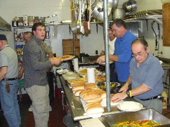 The kitchen was a busy place at the Nov. 30, 2007 fund-raiser for fire victims Julie Washburn and Bob Meckley. Almost $1,000 worth of sausages, meatball subs, salads and desserts was sold. Some of the crew pictured are Eddie Goff, Walter Crockett and Richard Corson.