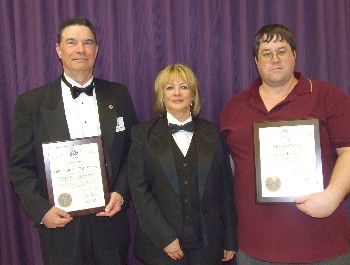 Michael D. Lange (left) was honored as 2008 Officer of the Year and Bruce McCollor (right) was named 2008 Elk of the Year by Exalted Ruler Julie A. Washburn at the lodge's annual award ceremonies.