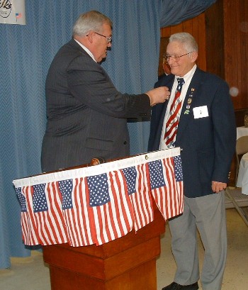 Grand Exalted Ruler Paul Helsel pins a 50-year membership pin on Past Exalted Ruler Roger E. Leblond at a Nov. 10, 2008 luncheon. Leblond was initiated Nov. 2, 1958 at the Woonsocket, R.I. lodge.