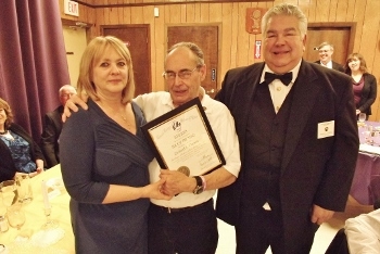 District Deputy Julie Meckley presents the 2012-13 Elk of the Year award to her father, Richard A. Corson at the March 23 Installation of Officers and Awards Banquet. Also pictured is Exalted Ruler Ron Voisine.