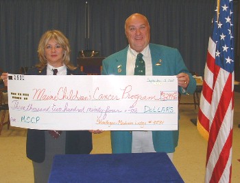 Skowhegan-Madison Elks Lodge Exalted Ruler Julie A. Washburn presents a check for $3,294 to Donald A. Richard, chairman of the Maine Elks Association Maine Childrens' Cancer Program Committee. Richard, a past state president, accepted the donation at the Oct. 10, 2007 meeting.
