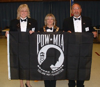 Inner Guard Robert Pomelow (right) presented a POW-MIA flag to the lodge at the Sept. 26 meeting. Pomelow, a Vietnam veteran, wanted the lodge to recognize the 89,000 American service members still unaccounted for since World War II. Accepting the flag are Lecturing Knight and Veterans Service Committee Chair Susan Horsman (left) and Exalted Ruler Julie A. Washburn (center).