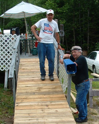 Vinal "Butch" Bridges (top), the late Harry Smith and Mike Lange (not shown)  rebuilt a wheelchair ramp for dialysis patient John Mallette of Harmony, ME. in September 2007. Despite a few showers, the lodge members completed the project in less than three hours.