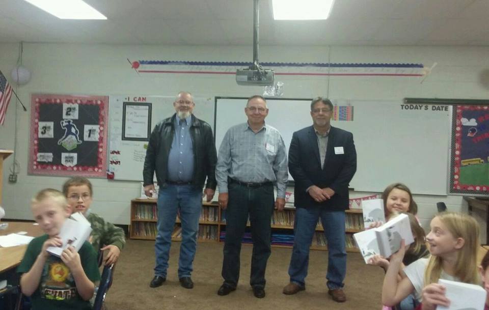 James,Dave and David delivering dictionaries to 3rd graders. 