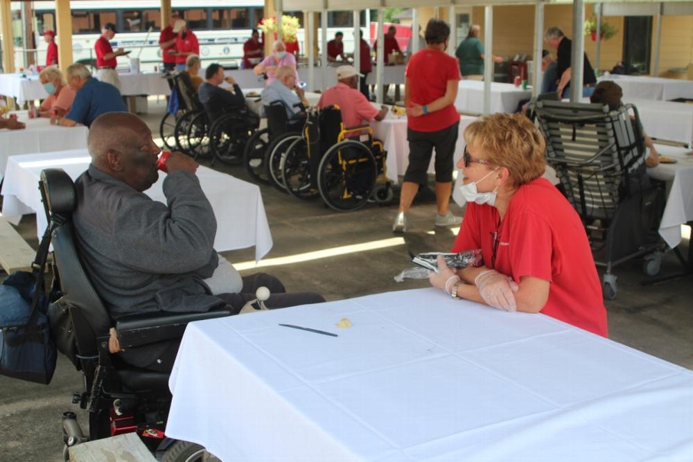 After a long year without seeing our Veterans (thanks to Covid 19) we were finally able to treat the vets to a BBQ lunch at the Ga War Veterans Home on July 16, 2021.  Pictured is Mary Zachary talking with one of the Vets.