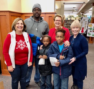 Members delivering coats to kids that had signed up for "Dolly Parton Imagination Library" at the library.  