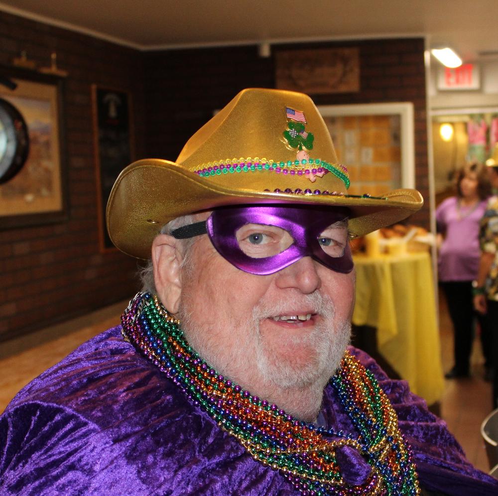 Santa cut his bread and put on a purple mask